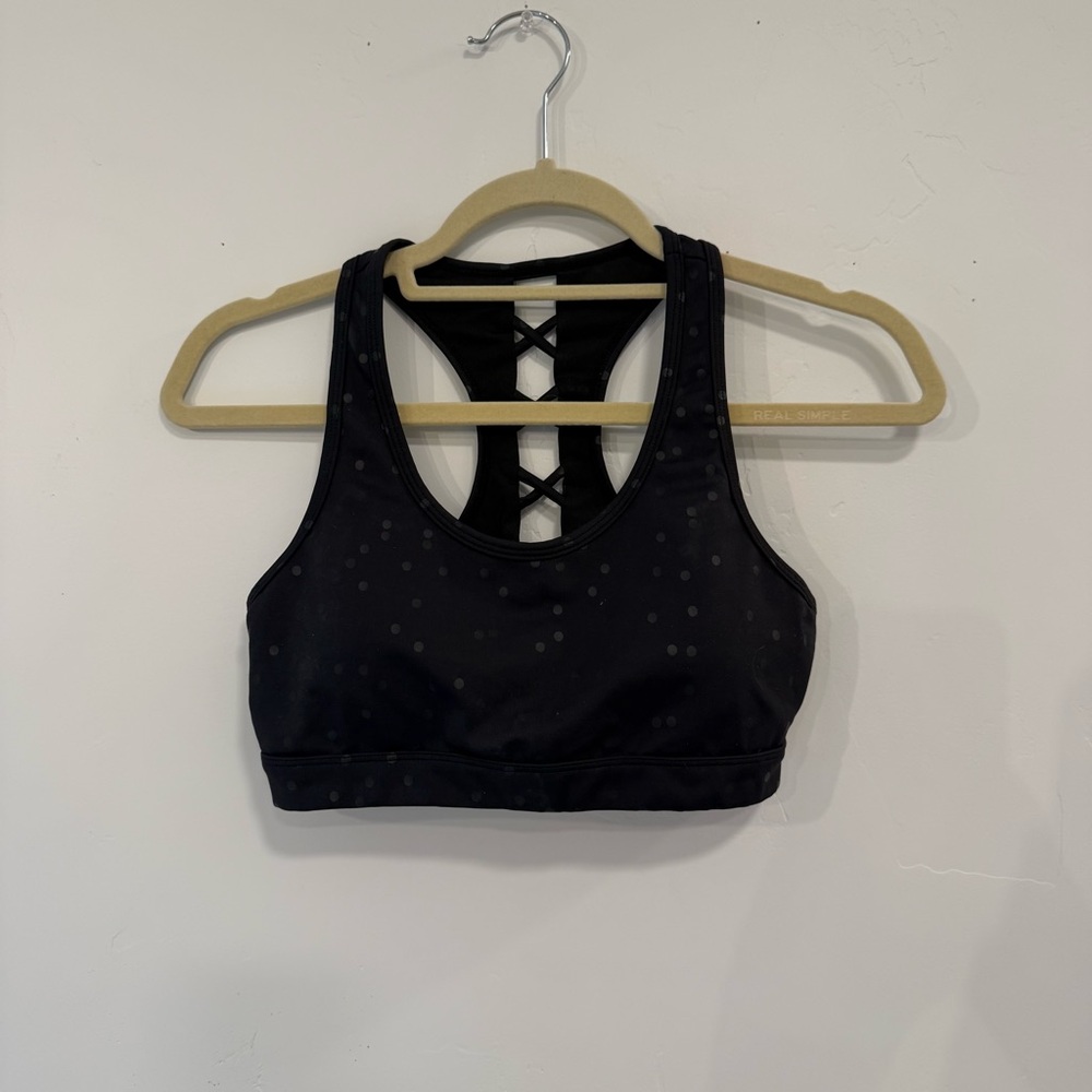 Elegant Black Polka Dot Sports Bra with Criss-Cross Back
